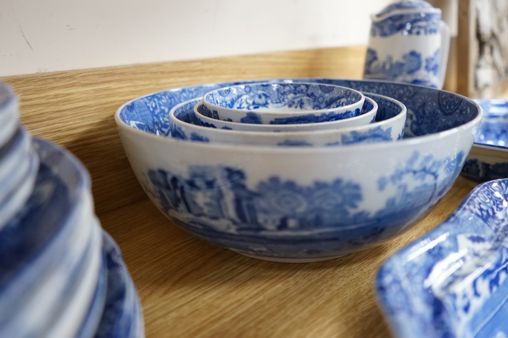 A Spode blue and white Italian service to include dinner plates, graduated bowls and platters, largest 37cm wide
